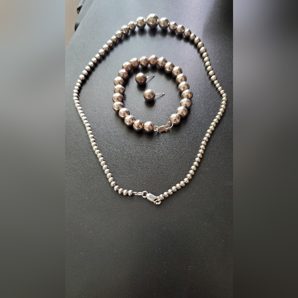Set of necklace, bracelet and earrings - silver color